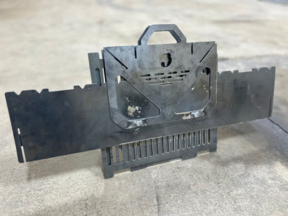 Black metal tool or device on a gray surface