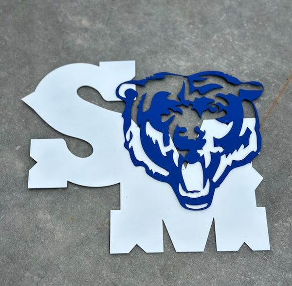 Blue tiger logo on a white 'SM' on a gray concrete background